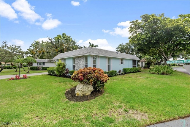 view of property exterior featuring a yard