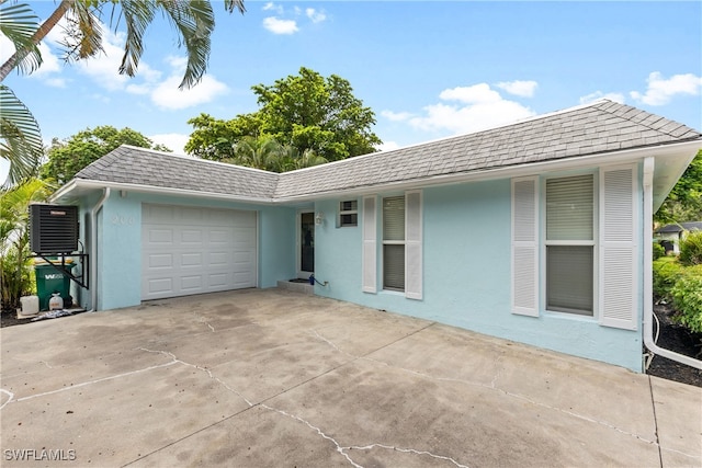 single story home featuring a garage