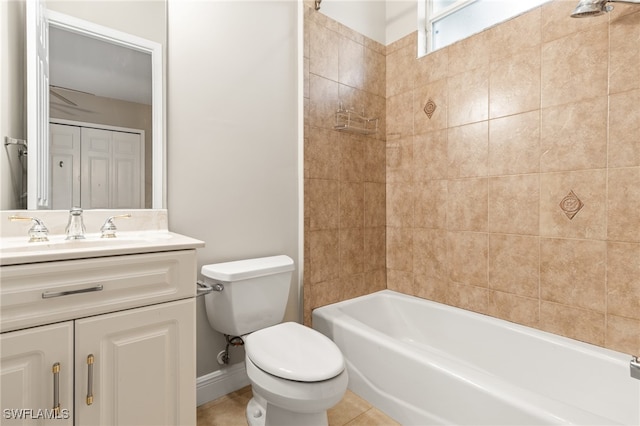 full bathroom featuring tile patterned flooring, toilet, vanity, and tiled shower / bath