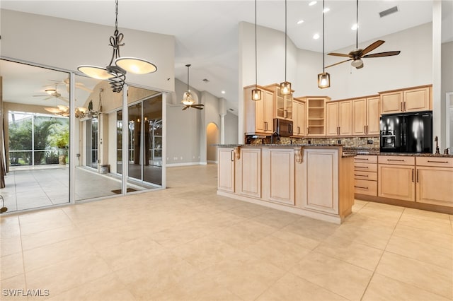 kitchen featuring light tile patterned floors, ceiling fan, black appliances, decorative backsplash, and high vaulted ceiling