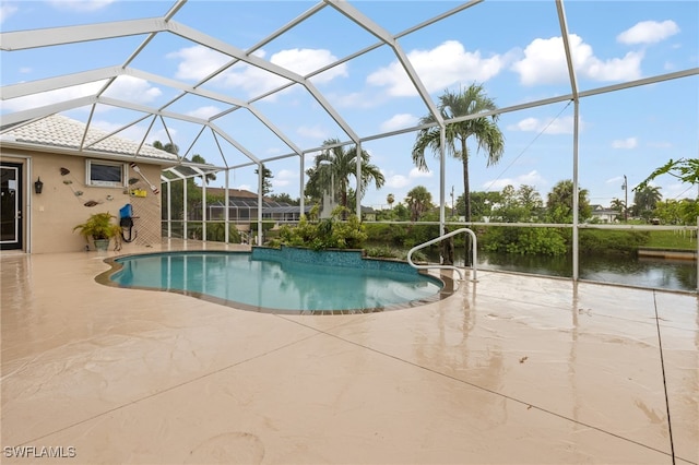 view of swimming pool featuring a patio and a lanai