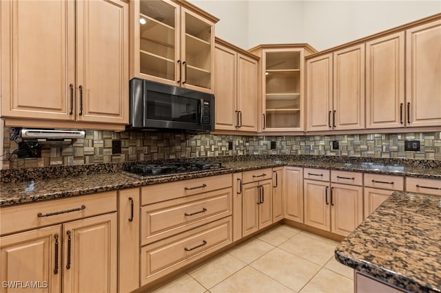 kitchen featuring black gas cooktop, tasteful backsplash, light brown cabinetry, and light tile patterned floors