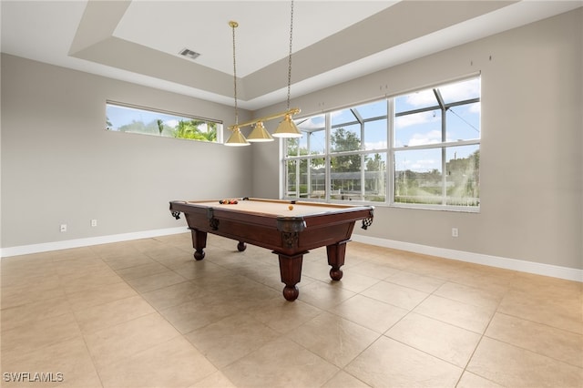 game room with light tile patterned floors, a raised ceiling, and billiards