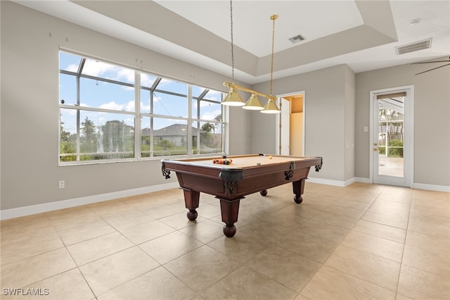 rec room featuring light tile patterned flooring, a raised ceiling, billiards, and plenty of natural light