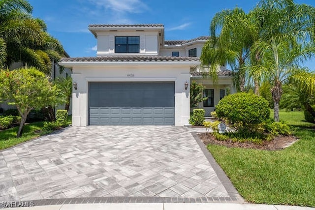 mediterranean / spanish house with a garage