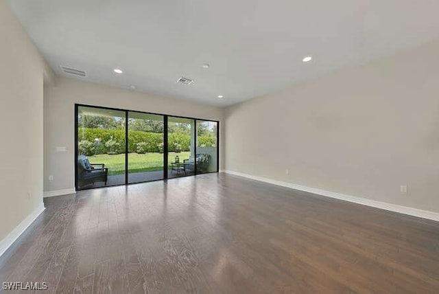 spare room featuring hardwood / wood-style floors