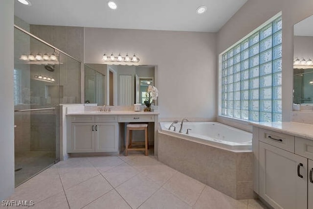 bathroom featuring vanity, separate shower and tub, and tile patterned flooring