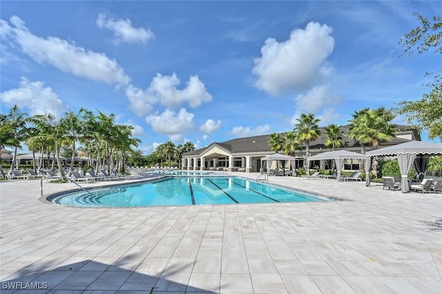 view of swimming pool with a patio area