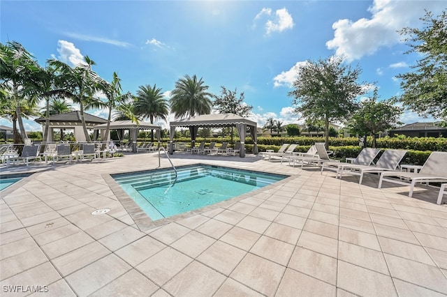 view of pool with a patio and a gazebo