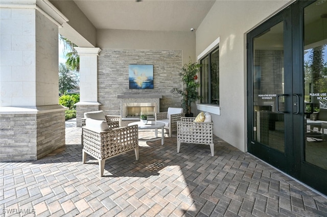 view of patio / terrace with an outdoor fireplace