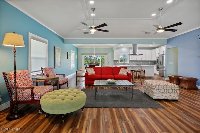 8335 Main St, Bokeelia, FL 33922 - living room with wood finished floors, ceiling fan, and crown molding