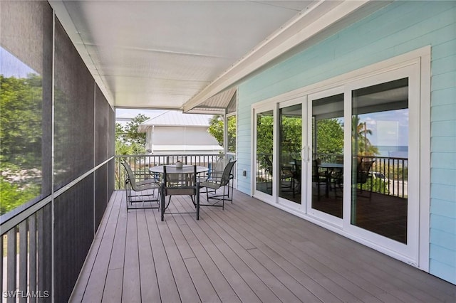 8335 Main St, Bokeelia, FL 33922 - wooden deck with outdoor dining space