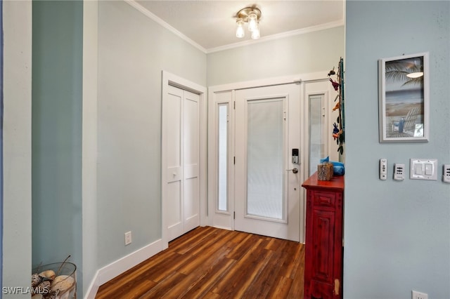 entrance foyer featuring dark wood-type flooring and ornamental molding