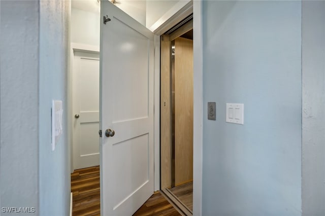 hallway featuring dark hardwood / wood-style floors