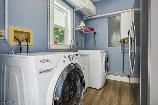 8335 Main St, Bokeelia, FL 33922 - washroom featuring wood finished floors, cabinet space, separate washer and dryer, and electric panel