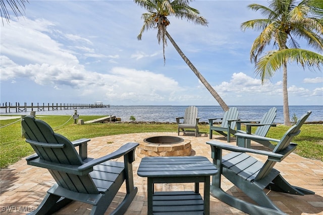 view of patio / terrace featuring a fire pit and a water view