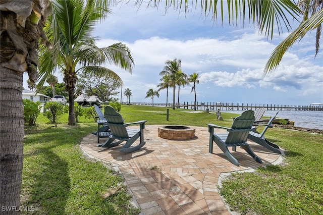 view of patio / terrace featuring a water view and an outdoor fire pit