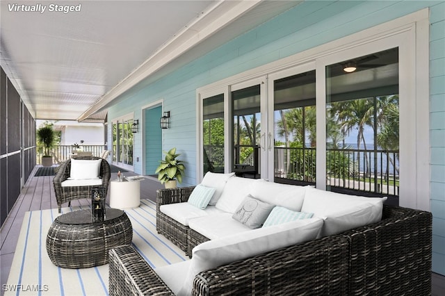 wooden deck featuring an outdoor hangout area