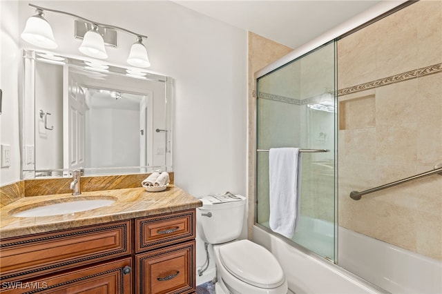 full bathroom featuring vanity, toilet, and enclosed tub / shower combo