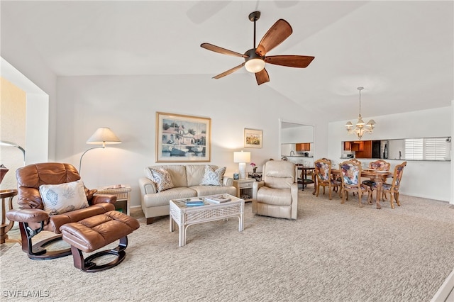 living room featuring ceiling fan with notable chandelier, carpet floors, and lofted ceiling