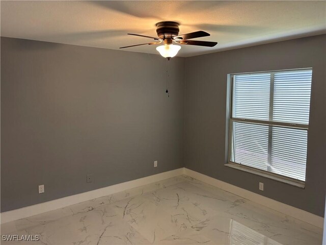 empty room featuring ceiling fan