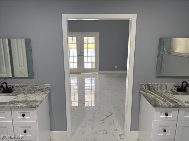 bathroom featuring french doors and vanity