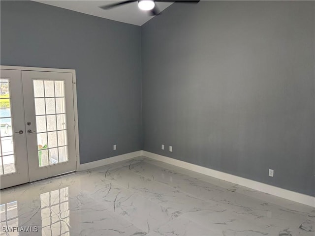 empty room with ceiling fan and french doors