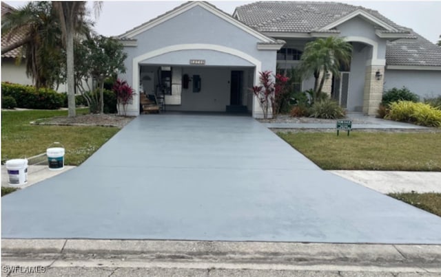 single story home with a garage and a front yard