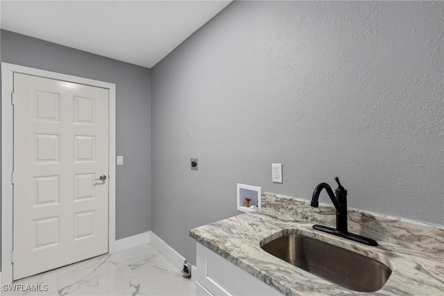 laundry area with hookup for an electric dryer, laundry area, washer hookup, a sink, and marble finish floor