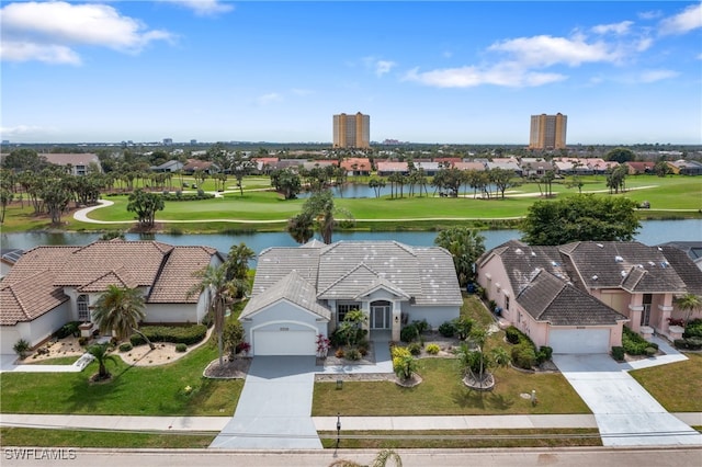 birds eye view of property featuring golf course view and a water view