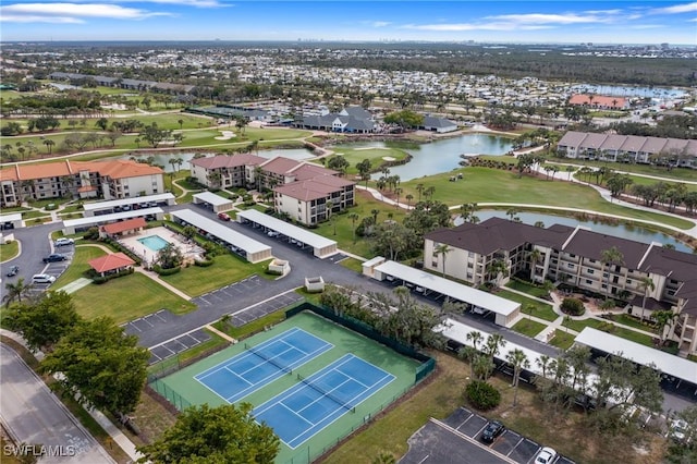 aerial view featuring a water view, a residential view, and golf course view