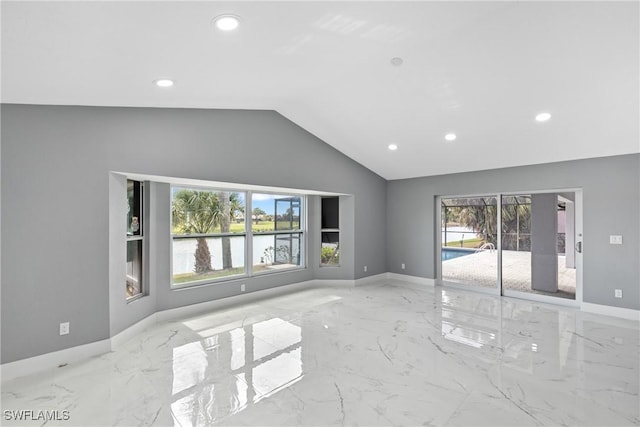 unfurnished living room featuring marble finish floor, baseboards, vaulted ceiling, and recessed lighting