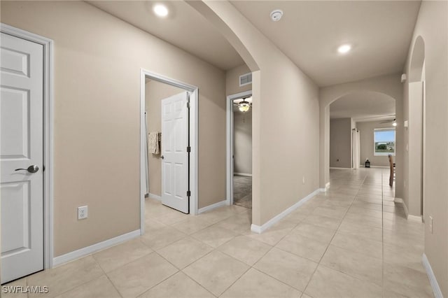 corridor with light tile patterned floors