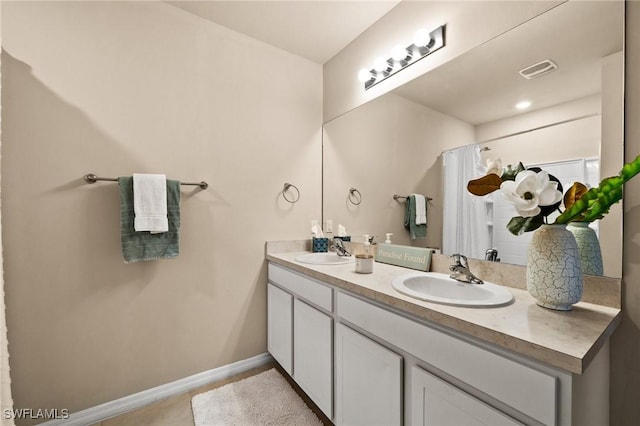 bathroom with vanity and a shower with shower curtain