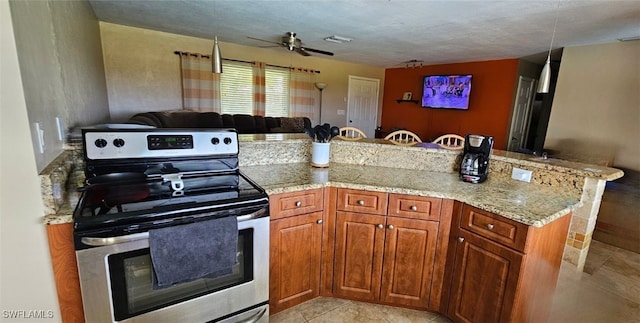 kitchen featuring light tile patterned floors, ceiling fan, stainless steel range with electric stovetop, light stone counters, and kitchen peninsula