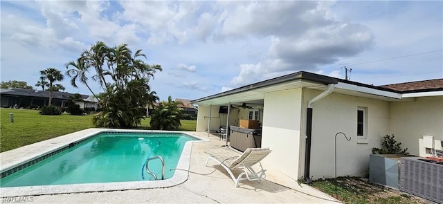 view of swimming pool with a patio area and a lawn