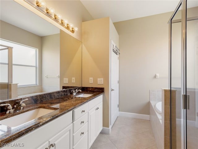 bathroom featuring plus walk in shower, tile patterned floors, and vanity