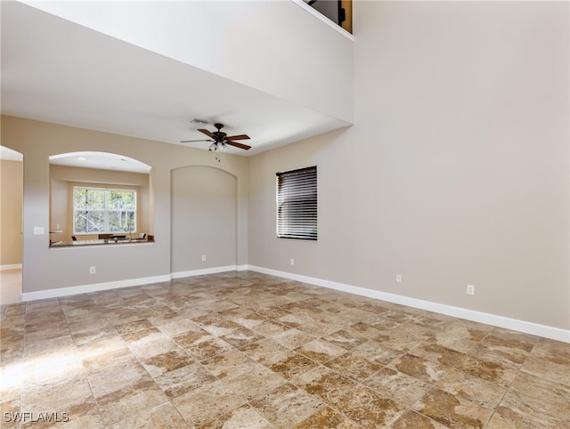 unfurnished room featuring ceiling fan