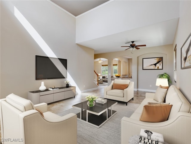 living room featuring ornamental molding and ceiling fan