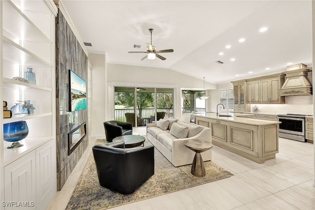 living room featuring ceiling fan, a fireplace, light tile patterned floors, and vaulted ceiling