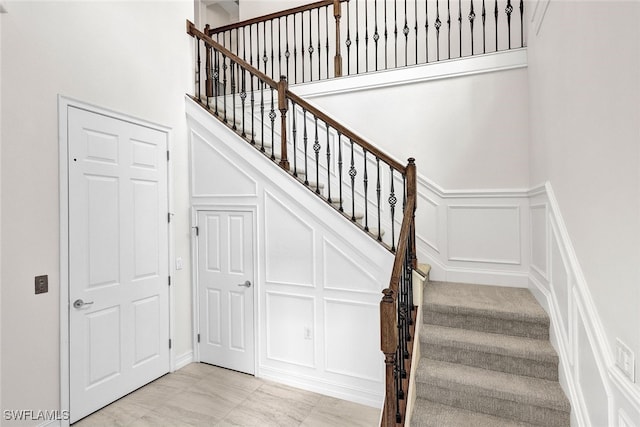 staircase with tile patterned floors