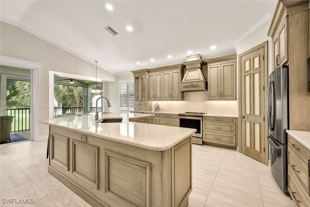 kitchen with appliances with stainless steel finishes, custom exhaust hood, sink, a large island with sink, and lofted ceiling