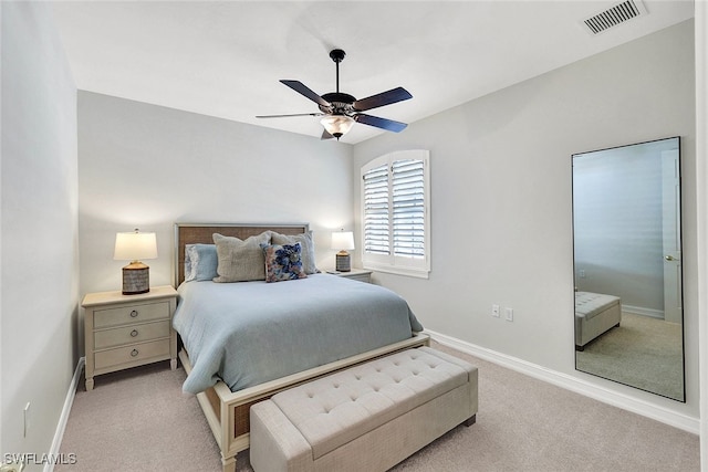 bedroom with a ceiling fan, light colored carpet, visible vents, and baseboards