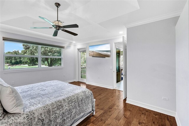 bedroom featuring ceiling fan, dark hardwood / wood-style floors, ornamental molding, and access to outside