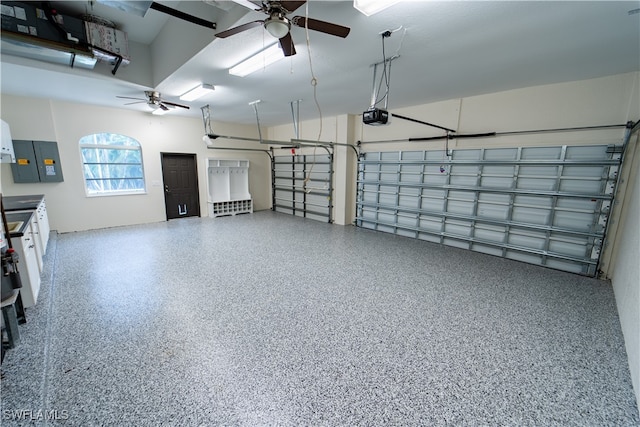 garage featuring a garage door opener and ceiling fan