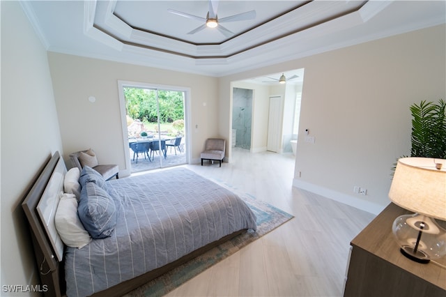 bedroom featuring ornamental molding, access to exterior, a raised ceiling, and ceiling fan