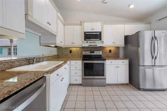 4130 Looking Glass Ln Unit 3802, Naples, FL 34112 - kitchen with stainless steel appliances, decorative backsplash, lofted ceiling, white cabinetry, and under cabinet range hood