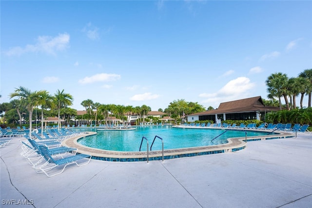 4130 Looking Glass Ln Unit 3802, Naples, FL 34112 - community pool with a patio