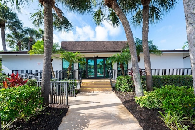 4130 Looking Glass Ln Unit 3802, Naples, FL 34112 - view of front of property featuring french doors and stucco siding