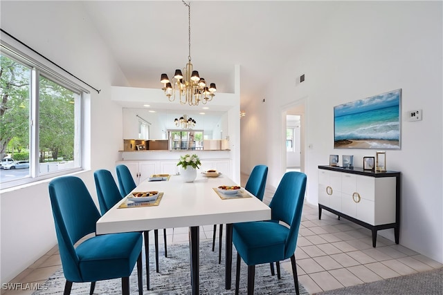 4130 Looking Glass Ln Unit 3802, Naples, FL 34112 - dining area with a chandelier, lofted ceiling, healthy amount of natural light, and light tile patterned floors